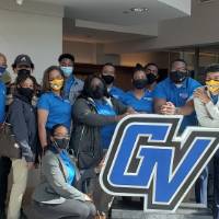 FVSU students and staff pose with the GV logo